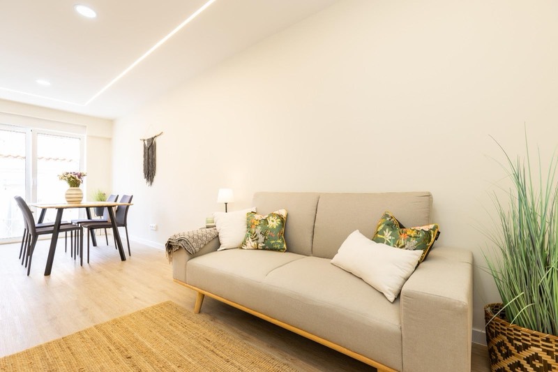 Living room with sofa, dining table and balcony light
