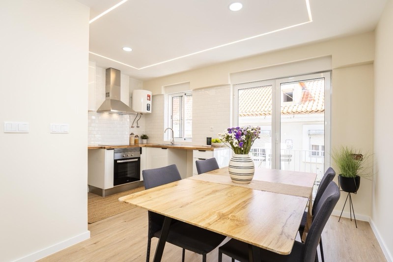 Sink beneath the kitchen window, next to the balcony door